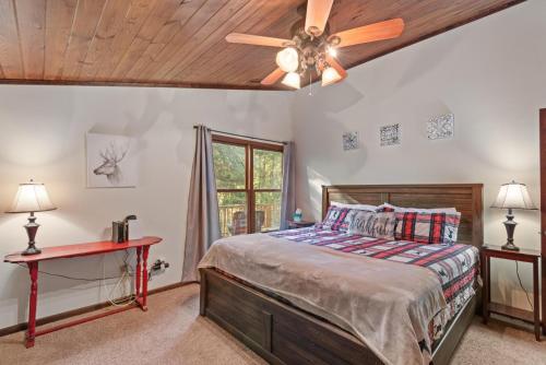 a bedroom with a bed and a ceiling fan at Banner Elk Lodge in Beech Mountain