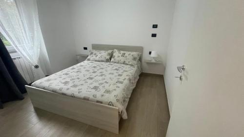 Postel nebo postele na pokoji v ubytování Cà De Qualì