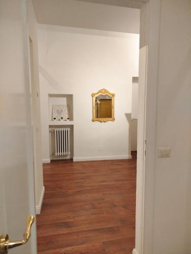 an empty room with a mirror on the wall at A Casa di Mavina - Luxury Stay in Siena