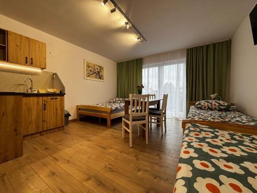 Postel nebo postele na pokoji v ubytování Pokoje gościnne Denega