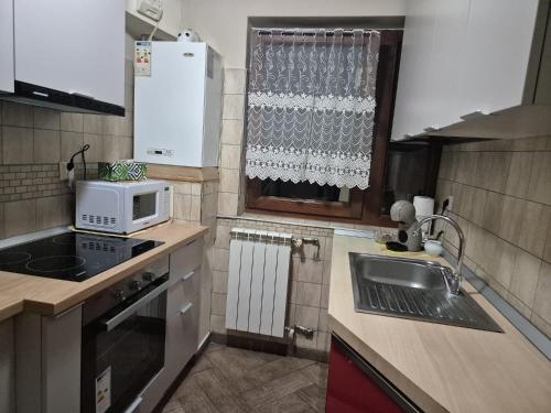 Kuchyň nebo kuchyňský kout v ubytování Cozy Central