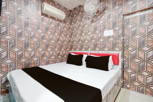 Ένα ή περισσότερα κρεβάτια σε δωμάτιο στο Hotel O Unique Stay Inn