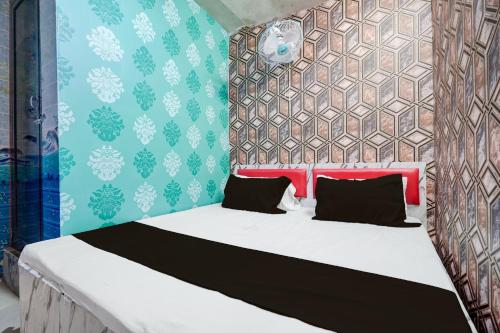 Ένα ή περισσότερα κρεβάτια σε δωμάτιο στο Hotel O Unique Stay Inn