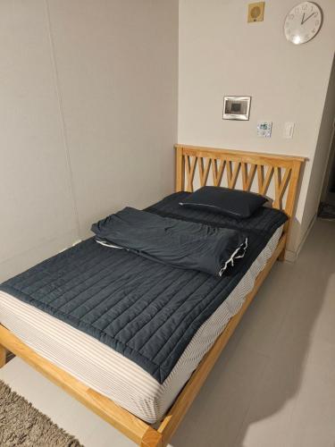 Ένα ή περισσότερα κρεβάτια σε δωμάτιο στο Urban Space Gangnam station