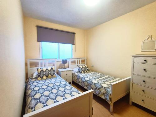 Ένα ή περισσότερα κρεβάτια σε δωμάτιο στο Miramar 4