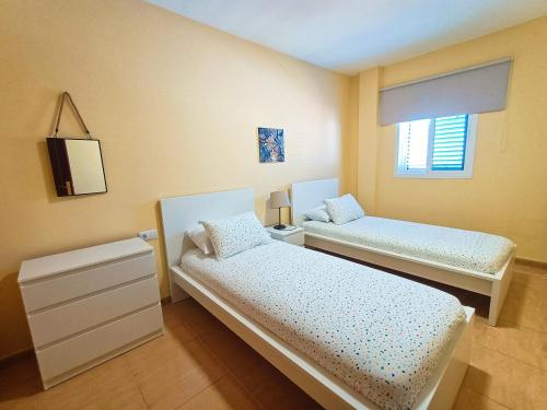 Ένα ή περισσότερα κρεβάτια σε δωμάτιο στο Miramar 10