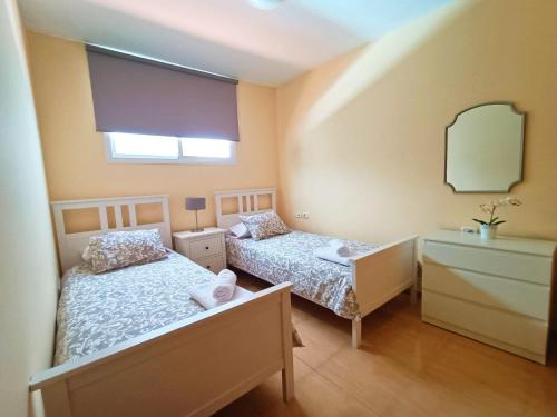 Ένα ή περισσότερα κρεβάτια σε δωμάτιο στο Miramar 3