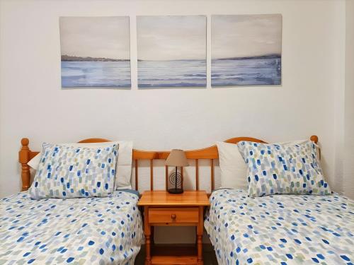 two beds sitting next to each other in a bedroom at Casa Marazul in Costa de Adeje