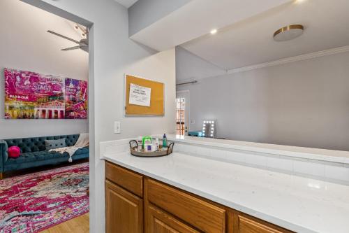 a kitchen with a counter and a living room at The Fancy Nancy in Nashville