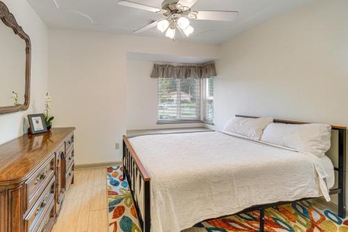a bedroom with a bed and a mirror and a window at Outdoor Kitchen & Patio! Central Valley Hacienda in Atwater