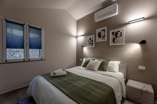 Ένα ή περισσότερα κρεβάτια σε δωμάτιο στο Alta Via 2 - Free Parking - Sea 20 min - A-C