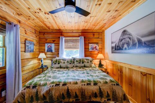 a bedroom with a bed and a ceiling fan at Rhododendron Rendezvous in Blowing Rock
