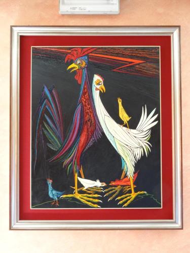a painting of three roosters on a table at Hotel Galles in Paluzza