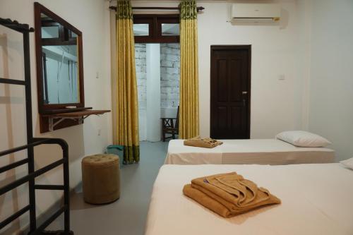 Ένα ή περισσότερα κρεβάτια σε δωμάτιο στο Three Elements