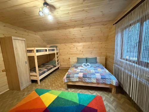 a bedroom with a bed and a bunk bed at La Canton Cheia in Cheia
