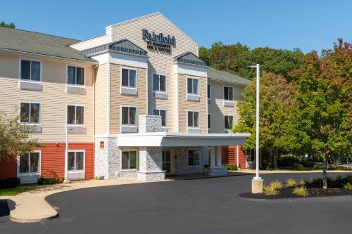 a hotel with a sign on the front of it at Fairfield Inn & Suites Hooksett in Manchester