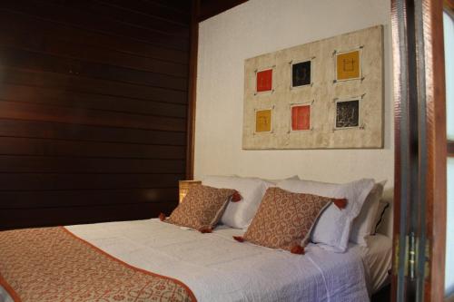 Ένα ή περισσότερα κρεβάτια σε δωμάτιο στο Chalé Oxossi