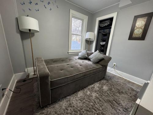 a living room with a couch and a window at 2 Bedroom Cozy Accommodation in Windsor