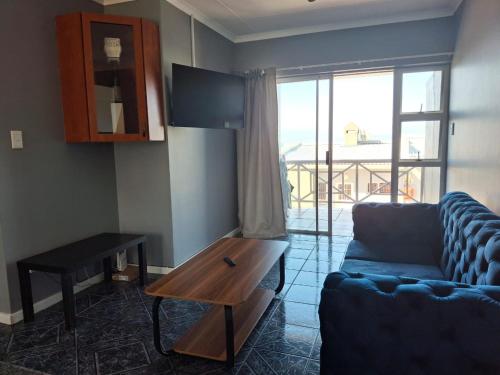 Et opholdsområde på Villa Chanel Beach Apartment