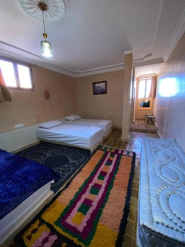 Ένα ή περισσότερα κρεβάτια σε δωμάτιο στο Auberge Soleil Bleu