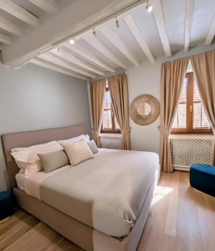 Ένα ή περισσότερα κρεβάτια σε δωμάτιο στο La Piccola Atene Atelier