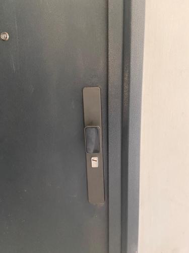 a close up of a metal door with a handle at Winnie's home in Athi River