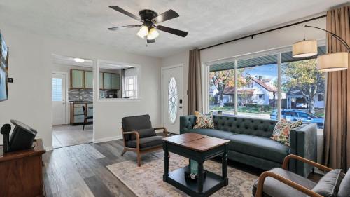 a living room with a couch and a table at Hearth Home Brick Oven Karaoke 4 Bedroom fits 8 in Columbus