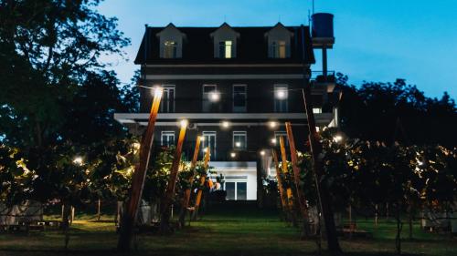 a large building with lights in front of it at LOTE20 Hotel Boutique in Bento Gonçalves