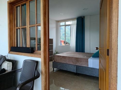 Ένα ή περισσότερα κρεβάτια σε δωμάτιο στο Panorama Café Hostel