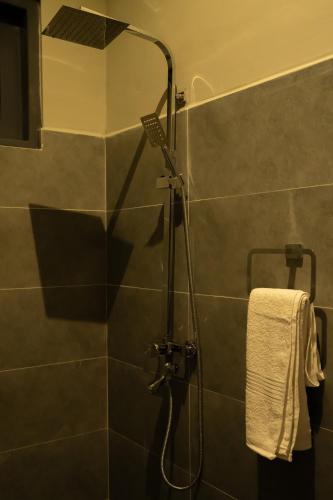 a shower with a shower head in a bathroom at Villa EN 22 in Galle