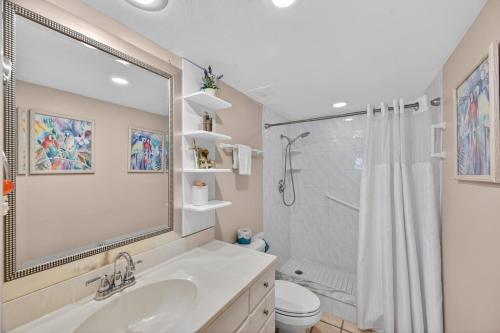 a bathroom with a sink and a shower and a toilet at Holiday Villas II Unit 301 in Clearwater Beach