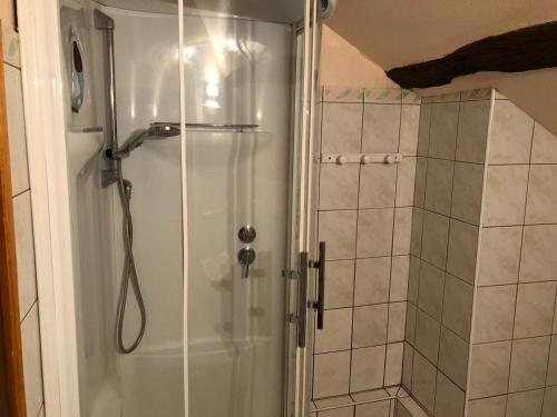 a shower with a glass door in a bathroom at Longère rénovée proche du Mans avec jardin et salle de jeux - FR-1-410-248 in Moncé-en-Belin