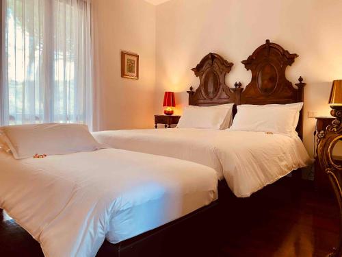 Ένα ή περισσότερα κρεβάτια σε δωμάτιο στο Pozzo Di Mezzo B&B