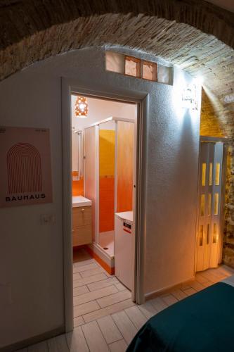 an open door to a kitchen in a room at Dimora del tufo in Narni