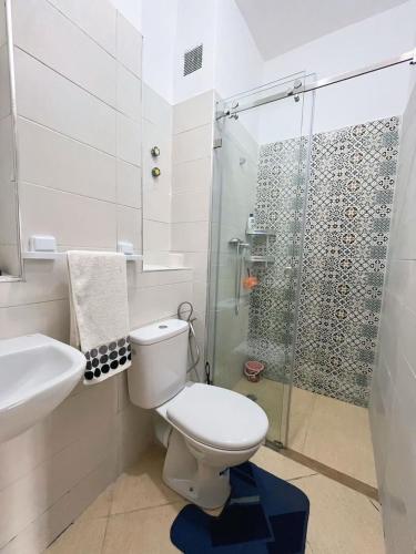 a bathroom with a toilet and a glass shower at Séjour détente près plage des nations in Sale
