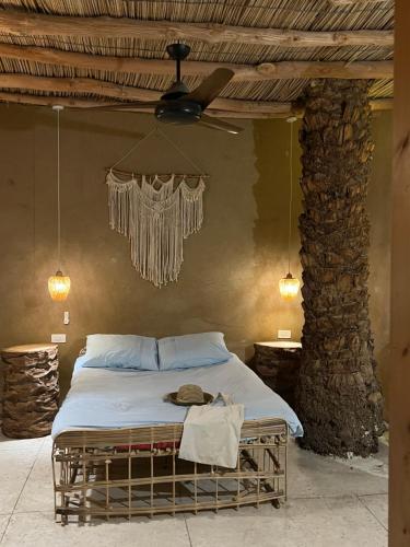 Ένα ή περισσότερα κρεβάτια σε δωμάτιο στο Gamandy Eco-Lodge