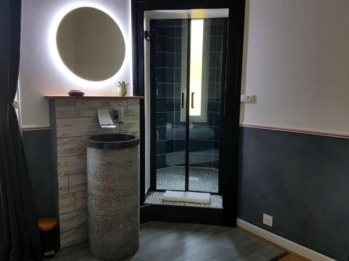 a bathroom with a shower with a glass door at Suite Familiale au Château avec Balcon sur Parc - FR-1-591-767 in Cluis