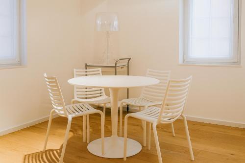 a white table and chairs in a room at Adorable Apartment City Center with Parking, Near Tram in Luxembourg