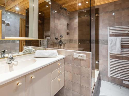 a bathroom with a sink and a shower at Duplex avec jardin et parking privatif à Serre Chevalier - FR-1-808-17 in Le Monêtier-les-Bains