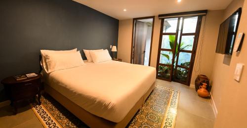 Voodi või voodid majutusasutuse Hotel Libreria Cafe de Pombal toas