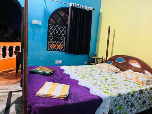 Ένα ή περισσότερα κρεβάτια σε δωμάτιο στο Mayelle Agonda