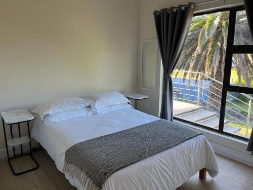 Ένα ή περισσότερα κρεβάτια σε δωμάτιο στο Villa Sardinia