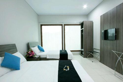 Una televisión o centro de entretenimiento en Balebale Resort