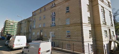 a large brick building with cars parked in front of it at amazing apartments - Annandale St near The Playhouse - Free Parking in Edinburgh