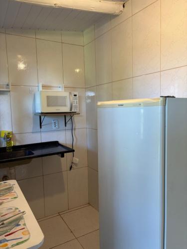 Kuchyň nebo kuchyňský kout v ubytování Cantinho da Natureza Aconchego no Centro