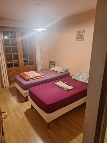 Un ou plusieurs lits dans un hébergement de l'établissement Maison au milieu des vignes