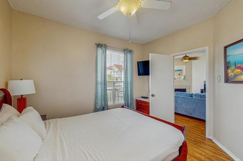 a bedroom with a bed and a window at Beach Club 280 in Padre Island