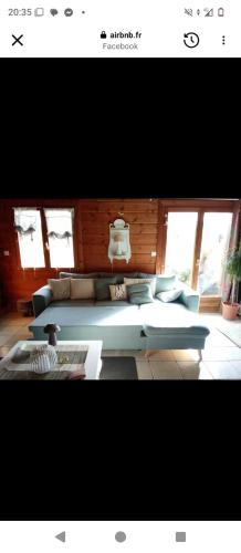 a living room with two couches and a couch at studio Nature & détente in Puessans