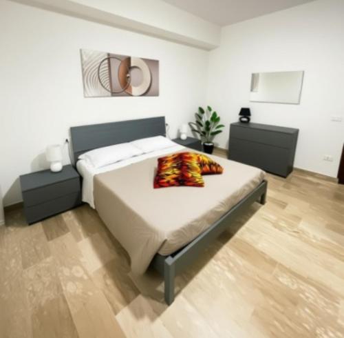 a bedroom with a large bed in a room at Residenza India in Avezzano