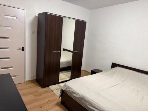 Postel nebo postele na pokoji v ubytování Urban apartament